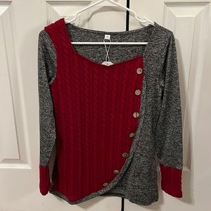 Brand new polyester and cable knit top, size small.